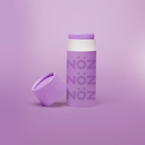 Sustainable packaging in colorful tube made of paper in the color purple by Nöz