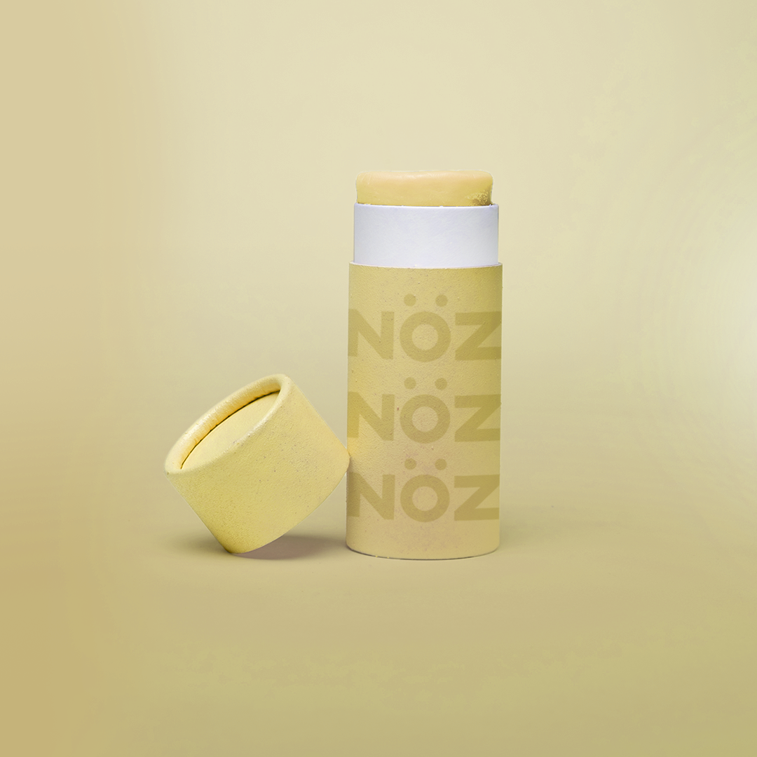 Bright Nöz sunscreen in sustainable paper packaging in the color yellow 